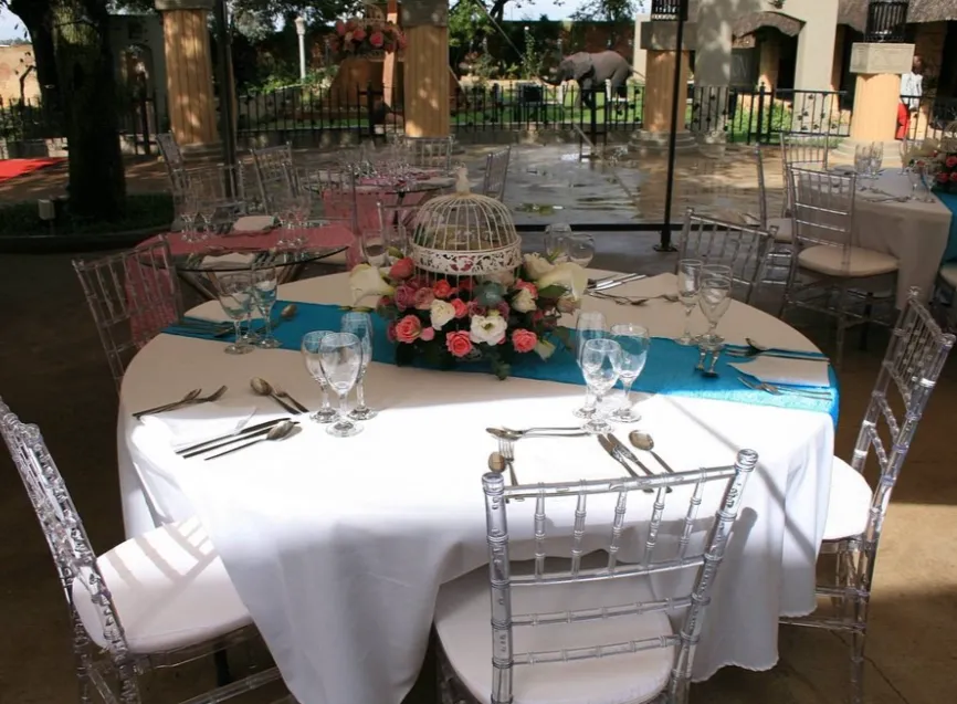 Open-air restaurant terrace at L'Arche De La Vie, overlooking the estate gardens